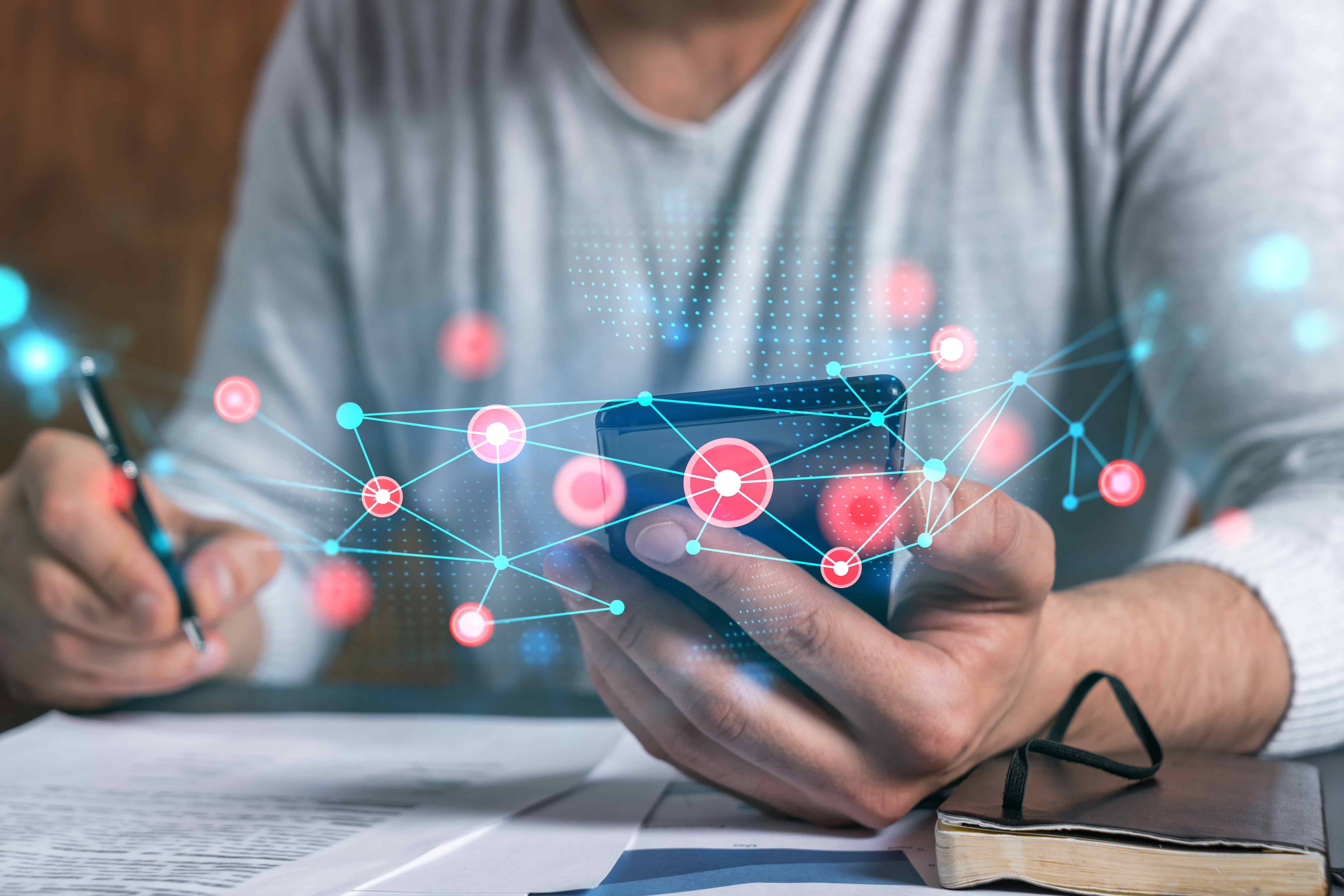 Person using a phone with a connected network overlay